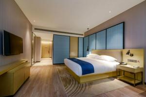 Postel nebo postele na pokoji v ubytování City Comfort Inn Hotel Nanning Nanhu Park Macun Metro Station