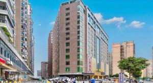 a tall building in the middle of a city at Zhonglian Harbor Hotel in Shanwei