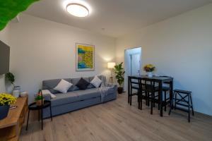 a living room with a couch and a table at Shifon Ein Zivan in Ein Zivan