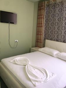 Postel nebo postele na pokoji v ubytování British Hotel