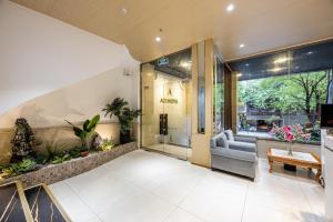 a lobby of a store with a waiting room at A25 Hotel - 277 Lê Thánh Tôn in Ho Chi Minh City