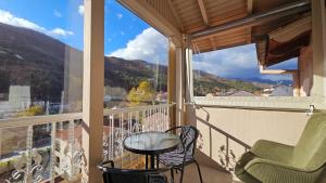 a balcony with a table and chairs and a view at Agapi apartment in Florina