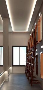 a room with a row of stairs in a building at The Rich Cafe & Hostel in Pattaya South