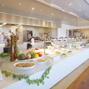 a buffet line with plates of food in a restaurant at Nippondaira Hotel in Shizuoka