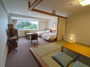 Postel nebo postele na pokoji v ubytování Hotel Harvest Hamanako