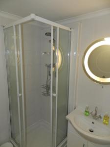 a bathroom with a shower, toilet, and sink at Weymouth Beach B&B - Adult Only in Weymouth
