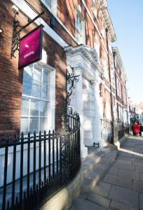 un edificio con un cartel en el costado en Safestay York Micklegate, en York