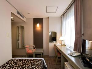 Ένα ή περισσότερα κρεβάτια σε δωμάτιο στο New Biwako Hotel