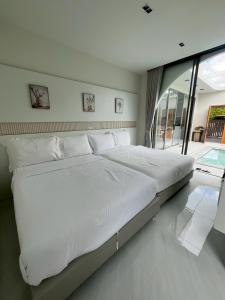 Postel nebo postele na pokoji v ubytování Jasmine Pool Villa + 5 fotografií