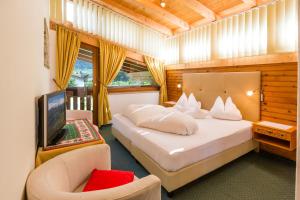 Postel nebo postele na pokoji v ubytování Garni - Hotel Rinner Julia