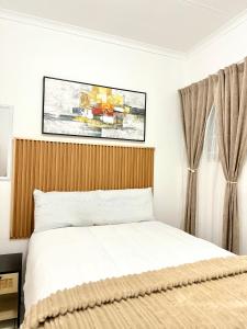 Postel nebo postele na pokoji v ubytování Bonno Apartment + 3 fotografie