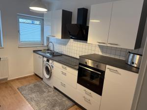 Kuchyň nebo kuchyňský kout v ubytování Home im Pott - Sehr Zentral - 4 Pers, TV