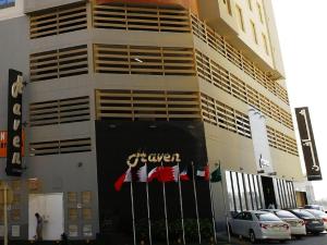 a building with a sign on the front of it at HAVEN TOWER in Juffair