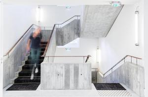 a person walking down stairs in a building at Ha(a)ïtza in Pyla-sur-Mer