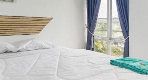 Ένα ή περισσότερα κρεβάτια σε δωμάτιο στο Hotel O Erbee Inn +68 φωτογραφίες