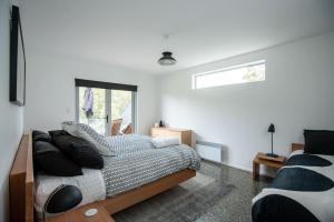 Ένα ή περισσότερα κρεβάτια σε δωμάτιο στο Bruny Island Haven