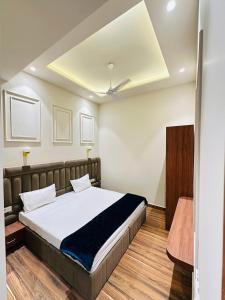 a bedroom with a bed in a room at Hotel Cloud 9 in Amritsar +15 photos