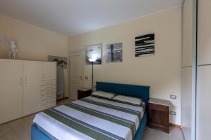 Кровать или кровати в номере The house on the river Wi-FiQCterme Quarenghi Clinic