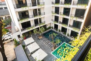 an overhead view of an apartment building with a swimming pool at The Green Hotel Vientiane in Vientiane