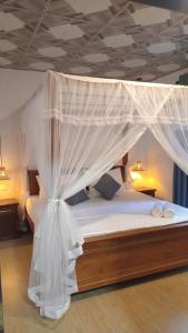 Postel nebo postele na pokoji v ubytování LEAFORA Cottage