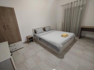 Postel nebo postele na pokoji v ubytování Kilkis Topfloor Apartment