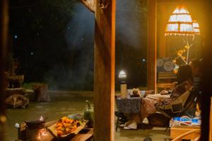 a person sitting in a chair on a stage at Casa De Dobby in Sa Pa