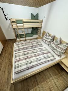 a bedroom with a bunk bed in a room at apart-gerlos in Gerlos