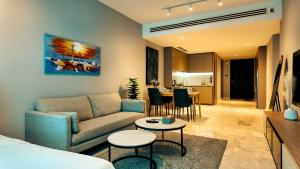 a living room with a couch and a table at Eaton Residence KLCC - J Home in Kuala Lumpur