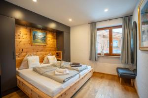 Postel nebo postele na pokoji v ubytování Schickster Sky Lodge