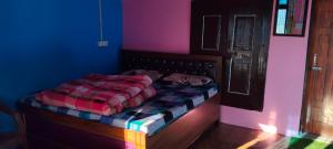 Ένα ή περισσότερα κρεβάτια σε δωμάτιο στο Patwal Home Stay