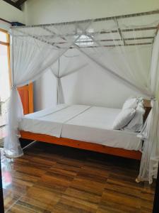 Postel nebo postele na pokoji v ubytování Nisadi Villa