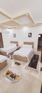 a room with two beds with plates of food on the floor at pyramids dreams in Cairo +178 photos