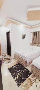 a bedroom with a bed in the middle of a room at pyramids dreams in Cairo