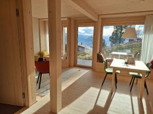 a room with a view of a living room at StrohGlück Rigi - traumhafte nachhaltige Ferienwohnungen mit toller Aussicht in Rigi Kaltbad