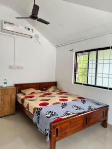 Postel nebo postele na pokoji v ubytování dream house fort kochi 2