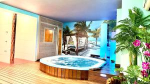 a jacuzzi tub in the middle of a room at Hotel Spa Galatea in Burela de Cabo +77 photos