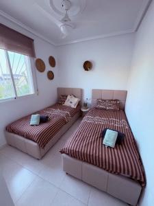 two twin beds in a room with two windows at Casa di Paddy in Ciudad Quesada +45 photos