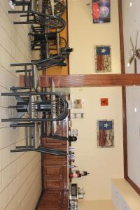 a bunch of bikes hanging from a wall at Truckerz Inn in Jacksonville