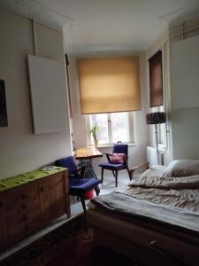 Ένα ή περισσότερα κρεβάτια σε δωμάτιο στο Dom otwarty