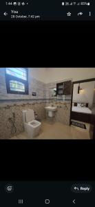 a bathroom with a toilet and a sink at Royal Villa Polhena in Matara +17 photos