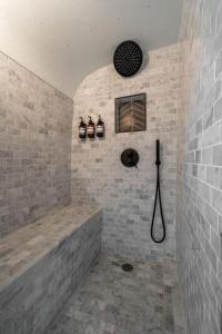 a bathroom with a shower with a shower at Prescott AZ Airstream Getaway One Block from Whiskey Row in Prescott +25 photos