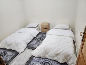 Ένα ή περισσότερα κρεβάτια σε δωμάτιο στο Aappartement laayoune Achifaa