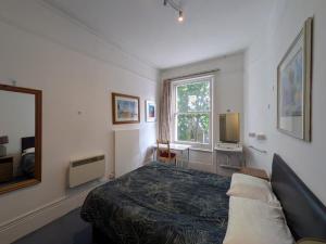 Postel nebo postele na pokoji v ubytování Curzon House Hotel