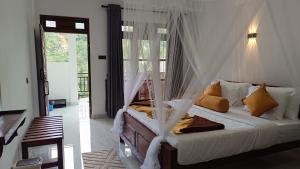 Ένα ή περισσότερα κρεβάτια σε δωμάτιο στο The Cloud Heaven Ella