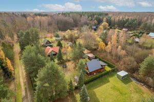 an aerial view of a house in a forest at Całoroczny, drewniany domek przy lesie in Prażmów