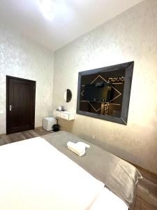 Postel nebo postele na pokoji v ubytování Baku City INN