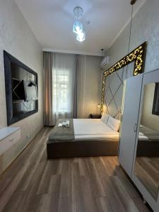 Postel nebo postele na pokoji v ubytování Baku City INN