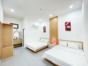 Un pat sau paturi într-o cameră la Quy Nhơn - KTK Homestay