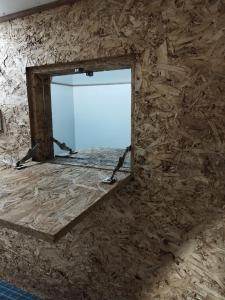 a mirror in a stone wall with a window at Sleepbox Hotel in Cameron Highlands +33 photos