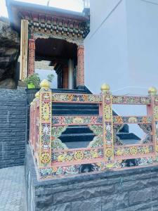 a building with a colorful design on the side of it at Hotel GaiaYuel in Thimphu
